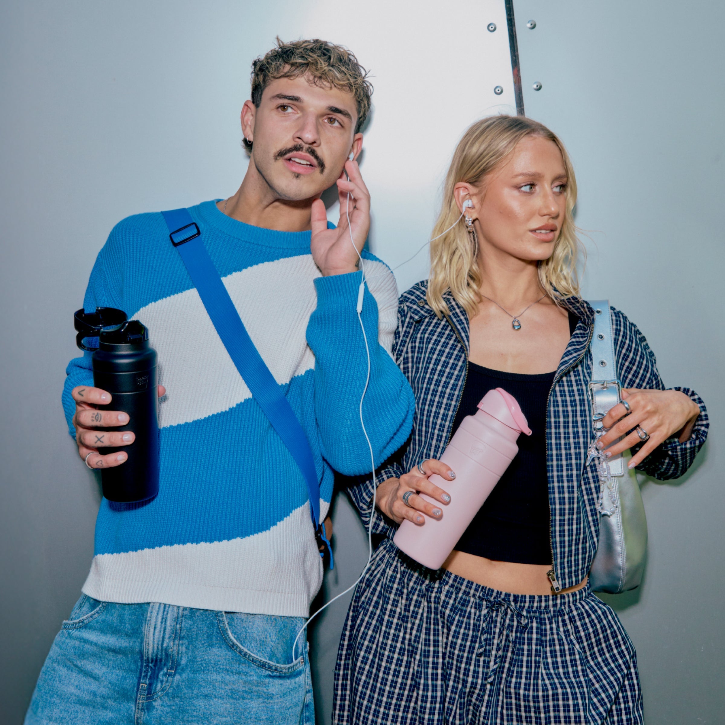 Person holding a KeepCup reusable water bottle, vacuum-insulated and leakproof for everyday carry