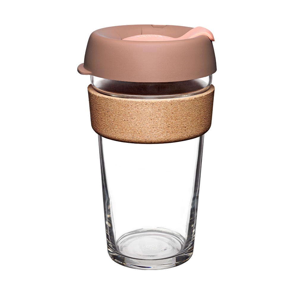 KeepCup Brew Cork L 16oz in Frappe colour, featuring a clear tempered glass cup with natural cork band and dusty pink silicone lid with sipper opening, shown on a plain white background.