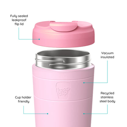 Pink vacuum-insulated KeepCup travel tumbler with a flip lid shown disassembled to highlight features, including a fully sealed leakproof flip lid, stainless steel interior, cup holder groove, and recycled steel body, on a white background.