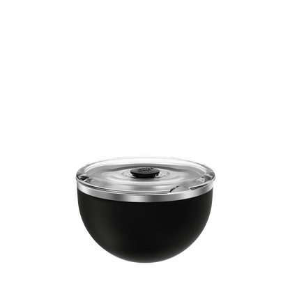 Go Bowl Luxe in Black with flat lid, shown from a front angle on a white background, featuring a matte black bowl base with stainless steel rim and clear plastic lid with central button.