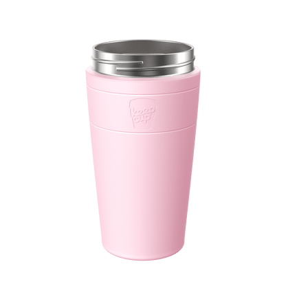 KeepCup Helix Stainless Steel Cup Base in soft pink, shown at a slight angle against a white background, featuring the embossed KeepCup logo and a stainless steel rim with drinking slot.