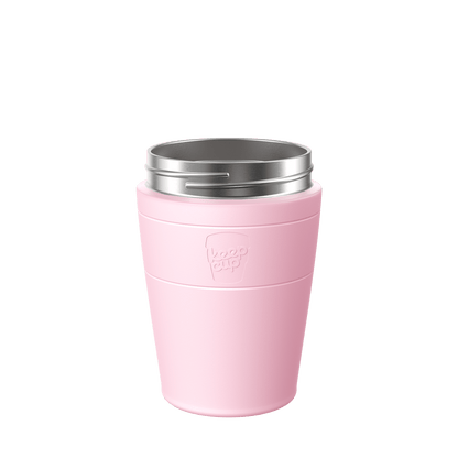 KeepCup Helix Stainless Steel Cup Base in soft pink, shown from a front angle against a white background, featuring the embossed KeepCup logo and a stainless steel rim at the top.