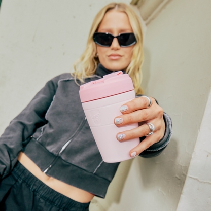 Person holding a Commuter Pashmak PInk with a neutral background