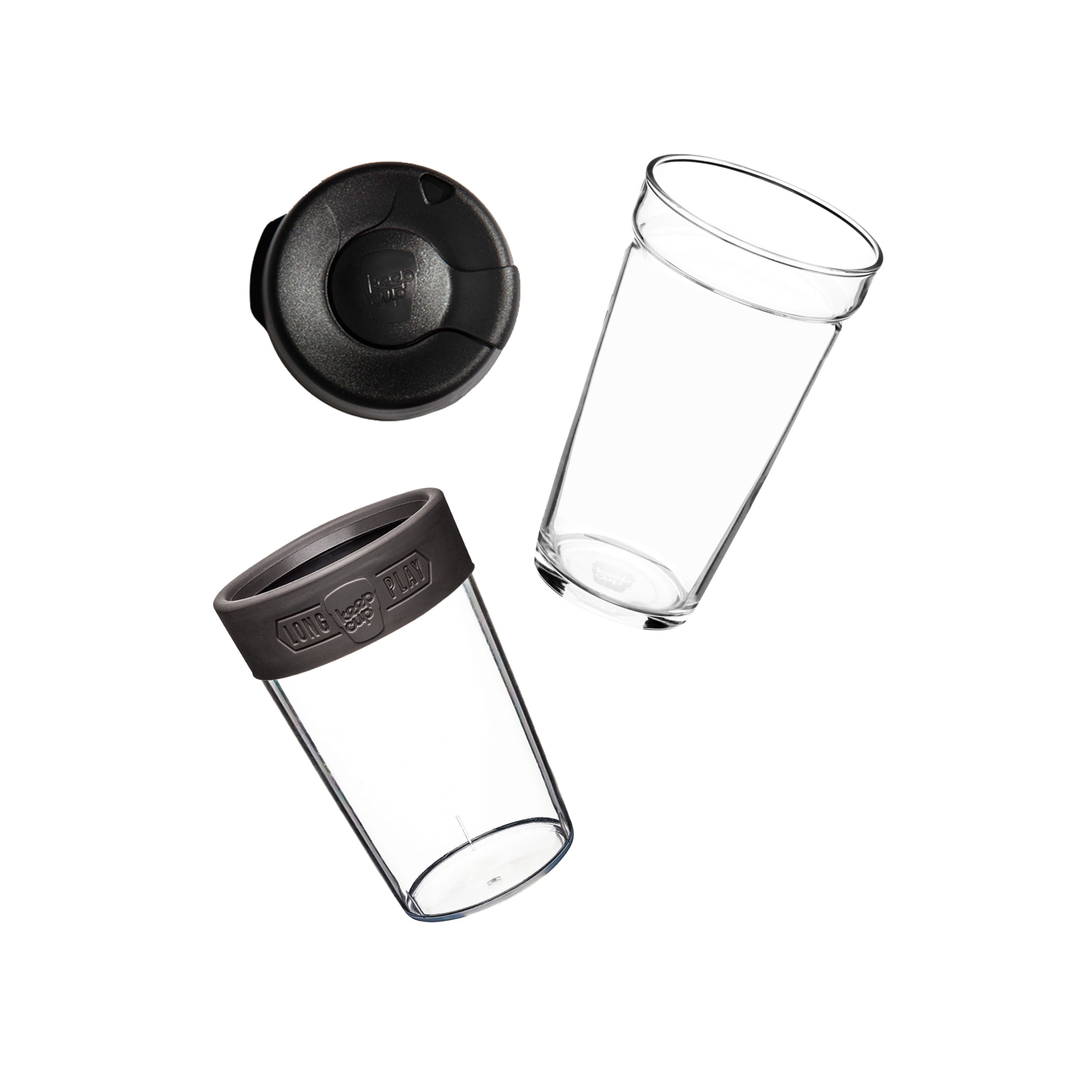 Flat lay showing the KeepCup Brew Longplay L 16oz disassembled into its components: plastic splashproof lid, clear glass cup, and grey silicone band with clear plastic outer cup.