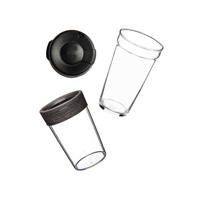 Flat lay showing the KeepCup Brew Longplay L 16oz disassembled into its components: plastic splashproof lid, clear glass cup, and grey silicone band with clear plastic outer cup.