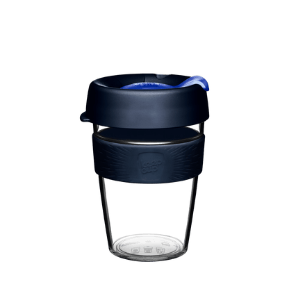 KeepCup Original Clear M 12oz in Ink colour, shown in a front-facing product shot against a white background, featuring a clear plastic cup with dark navy lid, blue plug, and teal silicone band with embossed KeepCup logo.