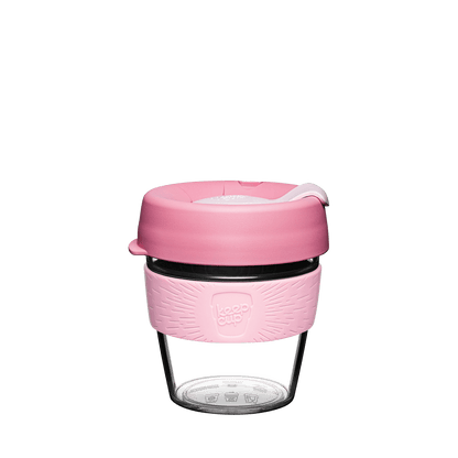 KeepCup Tritan plastic reusable coffee cup with a pink silicone sleeve and lid on a white background