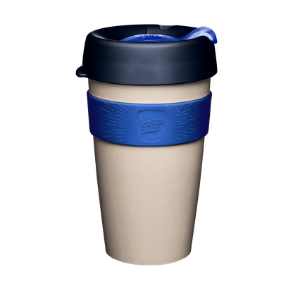 KeepCup Original L 16oz in Ink colour, featuring a beige cup body with dark navy lid, blue sipper plug, and blue silicone band with embossed KeepCup logo, shown against a white background.