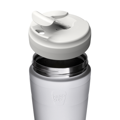 Close-up of a white insulated KeepCup travel tumbler with a matching white flip lid, shown on a clean white background. The embossed logo on the lower front reads 'keep cup'.
