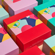 Colorful geometric-patterned gift boxes stacked together