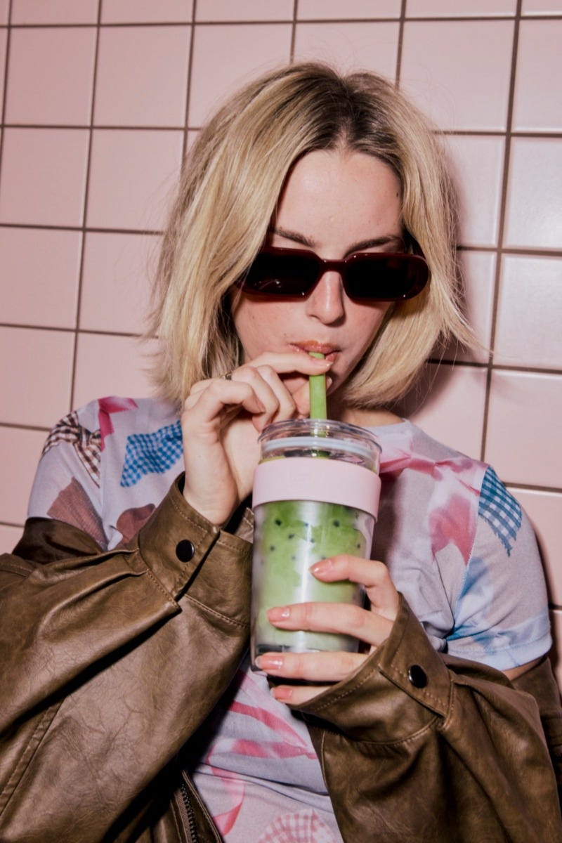 Woman holding KeepCup Cold Cup Longplay Pashmak Pink 16oz with iced matcha