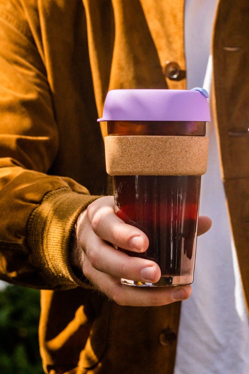 Man holding KeepCup Brew Cork 16oz with coffee