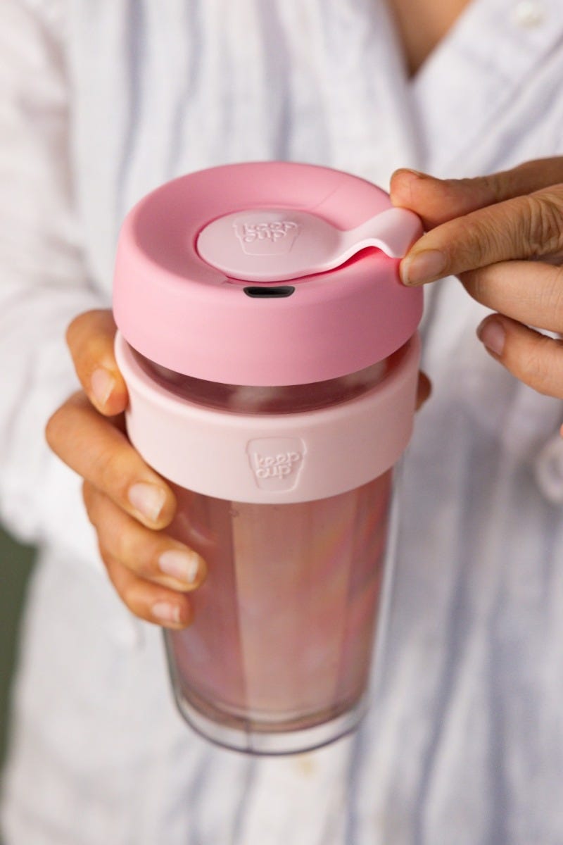 Woman holding KeepCup Brew Longplay 16oz with matcha tea