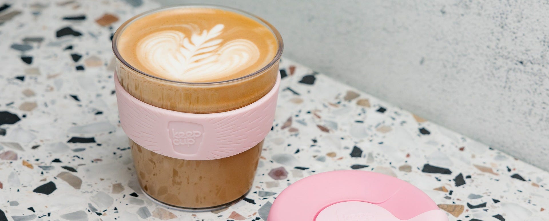 Woman lifting KeepCup Original lid off Small 8oz cup