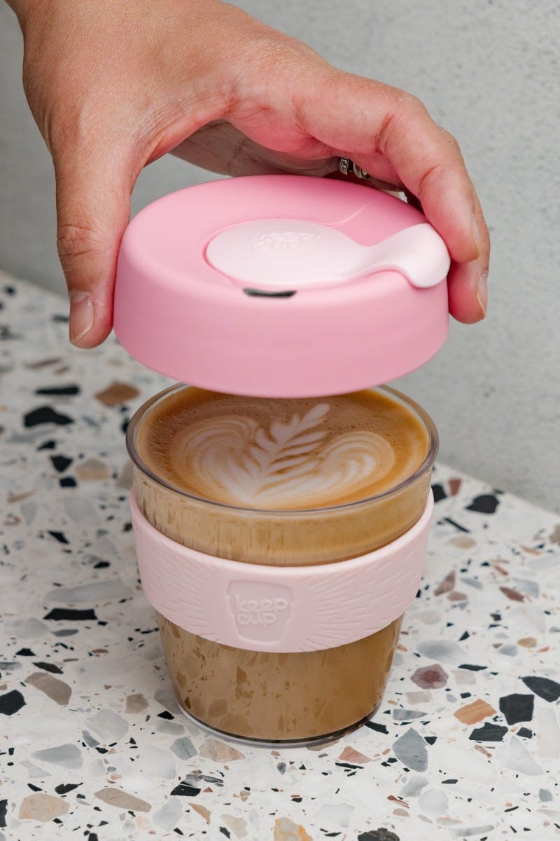 Woman lifting KeepCup Original lid off Small 8oz cup