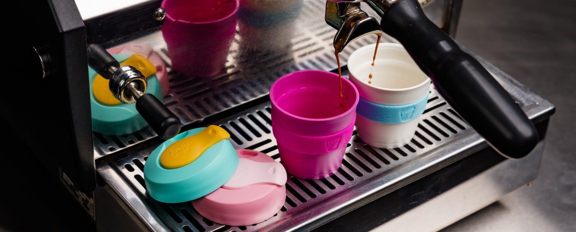 Child lifting KeepCup Original XS 4oz cup filled with granola