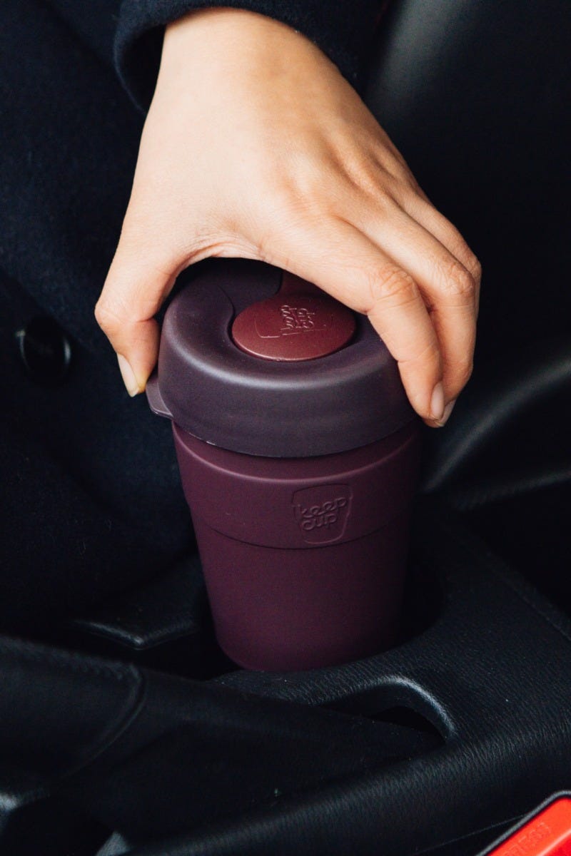Woman holding KeepCup Thermal M 12oz with coffee
