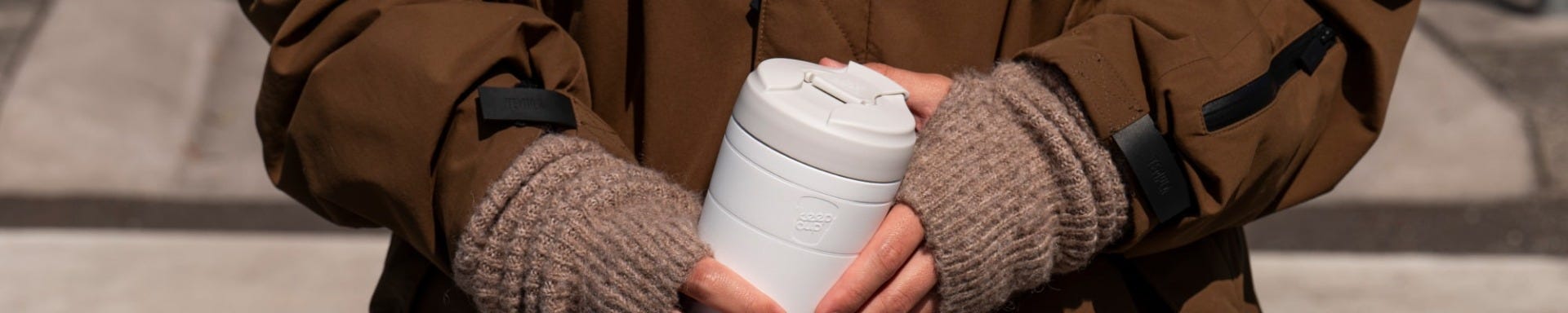 Person holding KeepCup Commuter in Bone