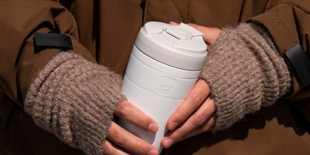 Person holding KeepCup Commuter in Bone