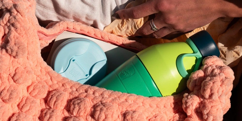 KeepCup Just Essentials gift bundle in Eden Cloud in woman’s handbag